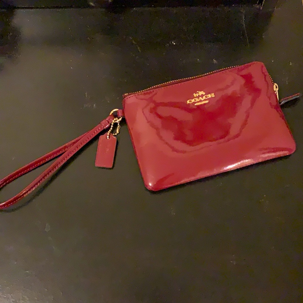 Burgundy Coach wristlet wallet. Barely used.